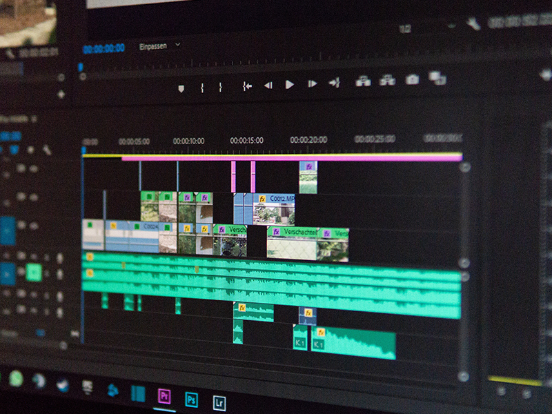 A computer with Premier Pro open to a project that is being edited.
